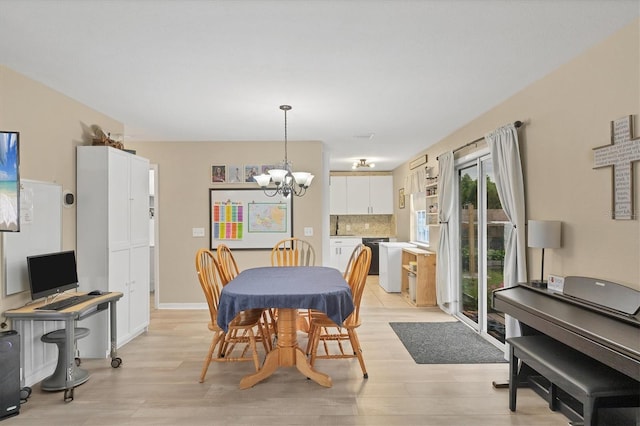 7590 Lyncrest St, North Port, FL 34287 - dining area featuring a chandelier and light wood-type flooring