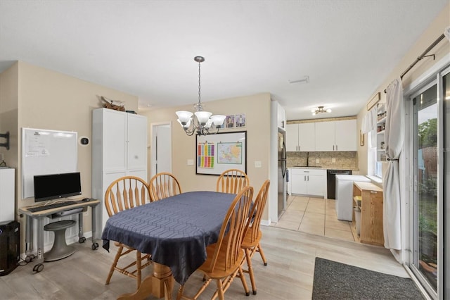 7590 Lyncrest St, North Port, FL 34287 - dining space featuring a chandelier and light wood finished floors