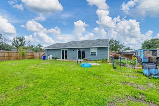 7590 Lyncrest St, North Port, FL 34287 - rear view of house with a fenced backyard