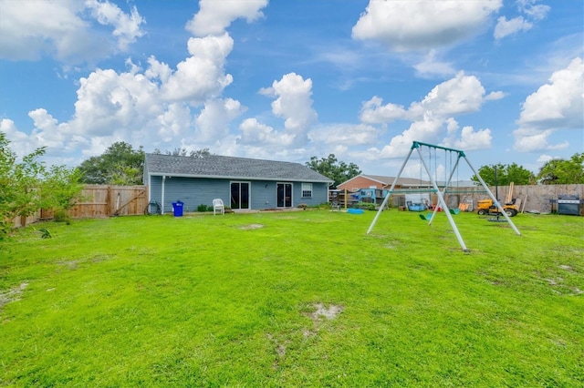 7590 Lyncrest St, North Port, FL 34287 - fenced backyard featuring a playground