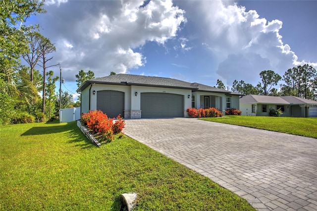 22156 Deborah Ave, Port Charlotte, FL 33954 - view of front of property with an attached garage, decorative driveway, and stucco siding