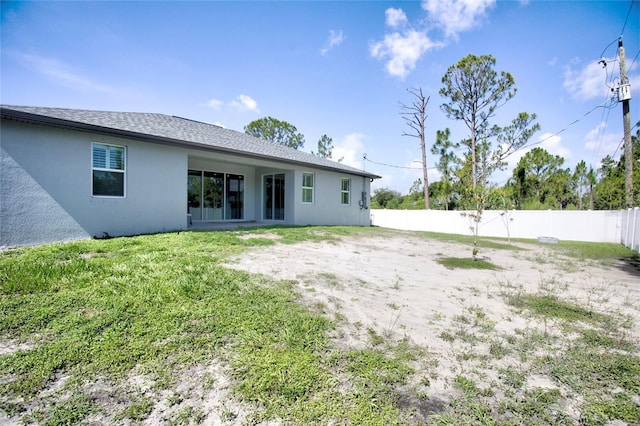 22156 Deborah Ave, Port Charlotte, FL 33954 - back of property with stucco siding and a fenced backyard