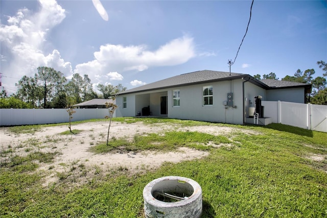 22156 Deborah Ave, Port Charlotte, FL 33954 - back of house with a fenced backyard and stucco siding