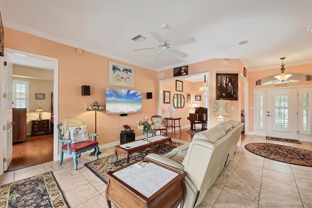 4 Pine Valley Pl, Rotonda West, FL 33947 - living area featuring ceiling fan, ornamental molding, and light tile patterned floors