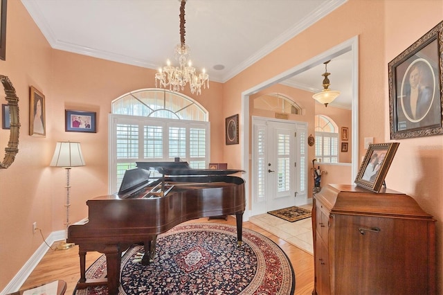 4 Pine Valley Pl, Rotonda West, FL 33947 - entrance foyer featuring a chandelier, ornamental molding, and light wood-style floors