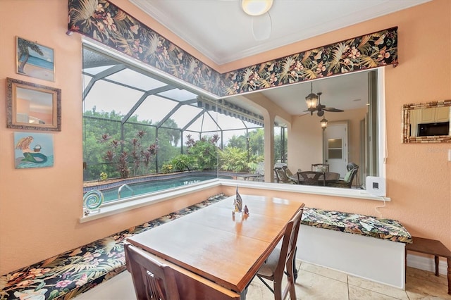 4 Pine Valley Pl, Rotonda West, FL 33947 - dining area featuring a ceiling fan, a sunroom, and crown molding