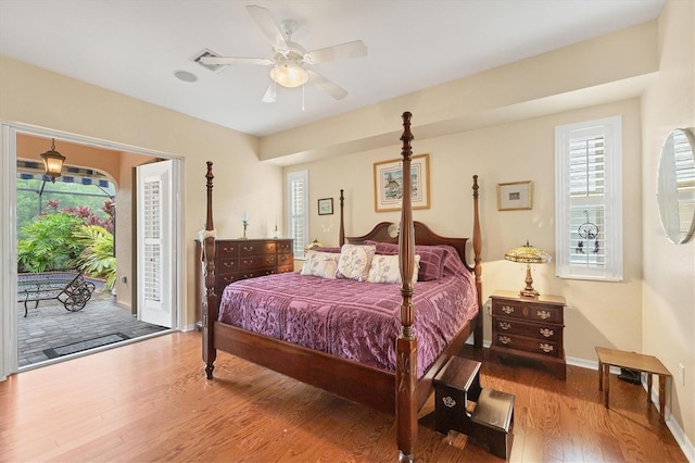 4 Pine Valley Pl, Rotonda West, FL 33947 - bedroom featuring access to outside, wood finished floors, and a ceiling fan