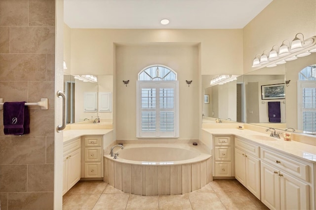4 Pine Valley Pl, Rotonda West, FL 33947 - bathroom featuring healthy amount of natural light, two vanities, and a bath
