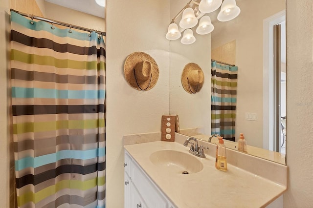 4 Pine Valley Pl, Rotonda West, FL 33947 - bathroom featuring vanity, a shower with curtain, and a textured wall