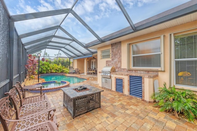 4 Pine Valley Pl, Rotonda West, FL 33947 - view of patio featuring exterior kitchen, a pool with connected hot tub, and a lanai