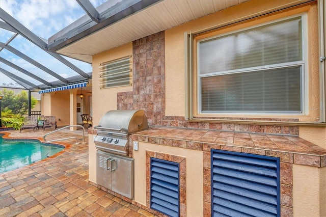 4 Pine Valley Pl, Rotonda West, FL 33947 - view of patio featuring area for grilling, glass enclosure, and an outdoor pool