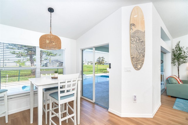 172 Mariner Ln, Rotonda West, FL 33947 - dining room with light wood-style floors and lofted ceiling