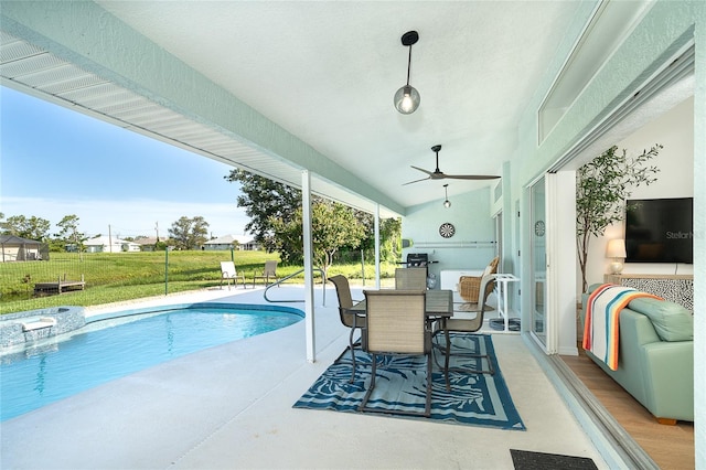 172 Mariner Ln, Rotonda West, FL 33947 - view of pool featuring ceiling fan, a pool with connected hot tub, a patio, a yard, and outdoor dining area