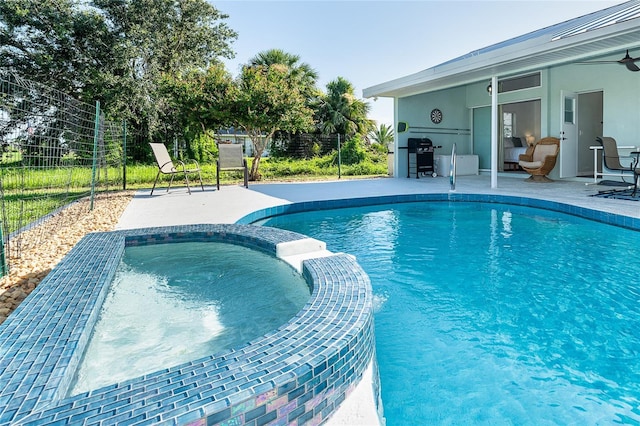 172 Mariner Ln, Rotonda West, FL 33947 - view of pool with a pool with connected hot tub, a patio, a ceiling fan, and grilling area