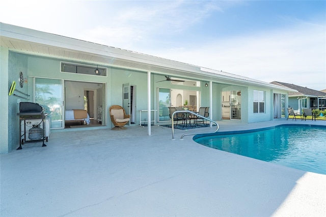 172 Mariner Ln, Rotonda West, FL 33947 - swimming pool featuring a patio, a grill, and a ceiling fan