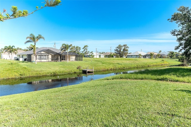 172 Mariner Ln, Rotonda West, FL 33947 - view of green lawn featuring a water view and a residential view