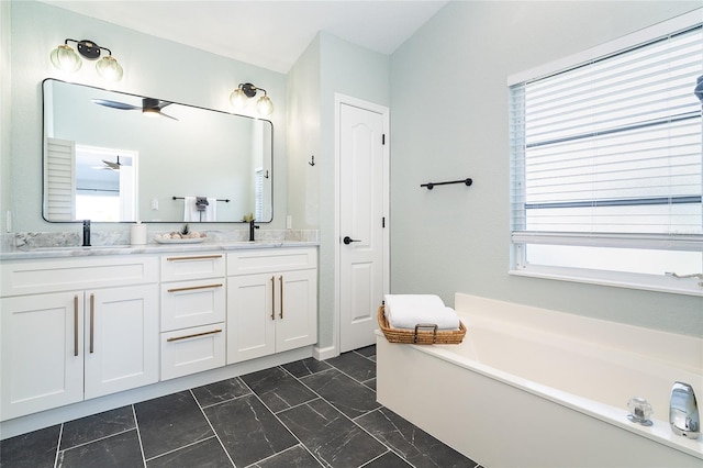 172 Mariner Ln, Rotonda West, FL 33947 - full bathroom with double vanity, a garden tub, and marble look tile flooring