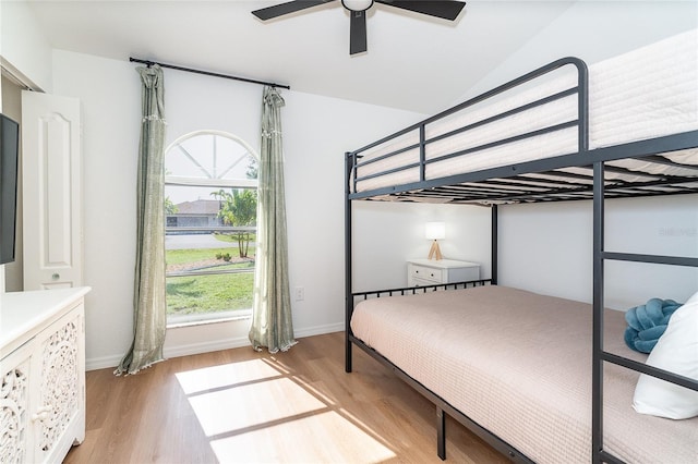 172 Mariner Ln, Rotonda West, FL 33947 - bedroom with light wood-type flooring, multiple windows, and a ceiling fan