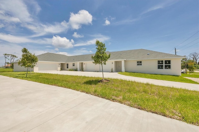 236 Boundary Blvd, Rotonda West, FL 33947 - single story home featuring a garage, concrete driveway, a front yard, and stucco siding