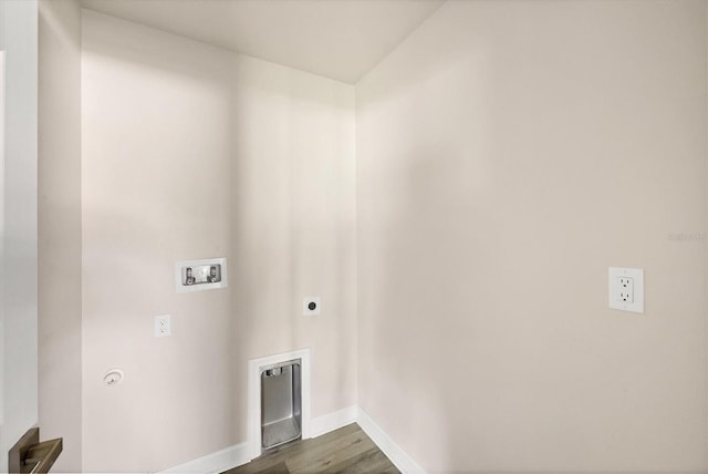 236 Boundary Blvd, Rotonda West, FL 33947 - washroom with washer hookup, electric dryer hookup, and dark wood-type flooring