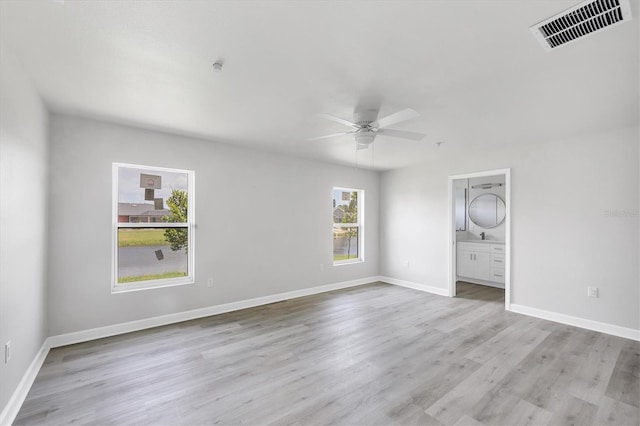 236 Boundary Blvd, Rotonda West, FL 33947 - empty room with plenty of natural light, light wood finished floors, and ceiling fan