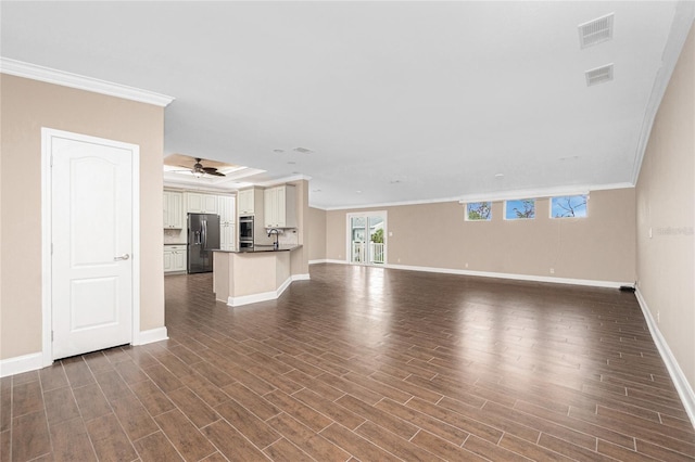 9150 Pine Cove Dr, Englewood, FL 34224 - unfurnished living room with crown molding, dark wood-style flooring, and ceiling fan