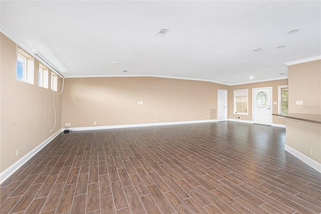 9150 Pine Cove Dr, Englewood, FL 34224 - unfurnished living room featuring crown molding, wood finished floors, plenty of natural light, and recessed lighting