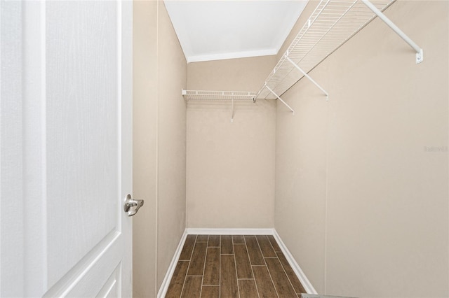 9150 Pine Cove Dr, Englewood, FL 34224 - walk in closet with dark wood-style flooring