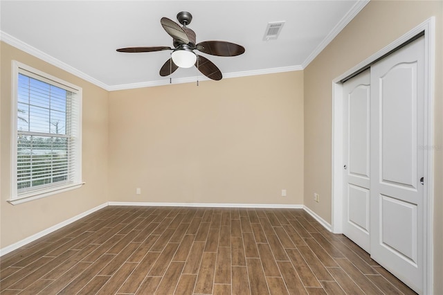 9150 Pine Cove Dr, Englewood, FL 34224 - unfurnished room with ornamental molding, dark wood-type flooring, and a ceiling fan
