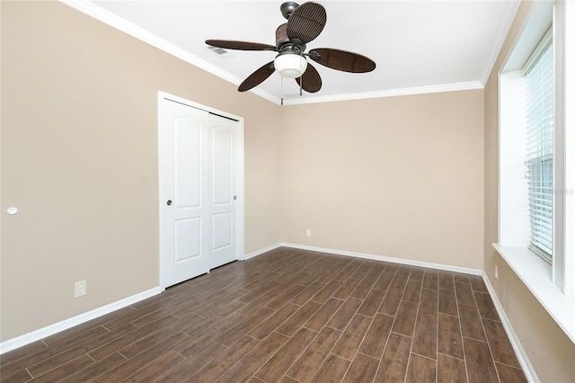 9150 Pine Cove Dr, Englewood, FL 34224 - unfurnished bedroom with ornamental molding, dark wood-style floors, a closet, and ceiling fan