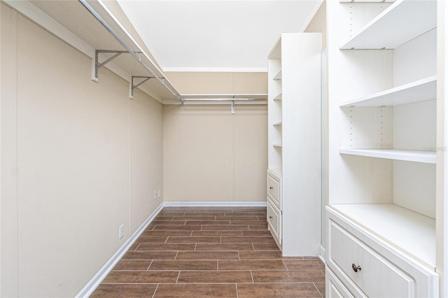 9150 Pine Cove Dr, Englewood, FL 34224 - walk in closet with dark wood-style floors