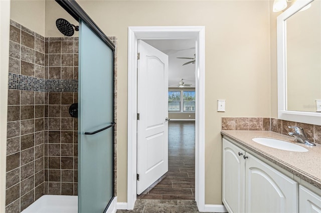 9150 Pine Cove Dr, Englewood, FL 34224 - full bath featuring a stall shower, vanity, wood finished floors, and a ceiling fan