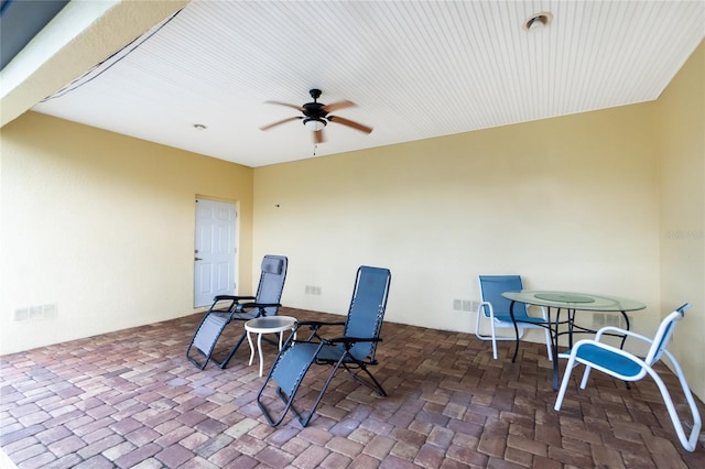 9150 Pine Cove Dr, Englewood, FL 34224 - view of patio with ceiling fan and outdoor dining space
