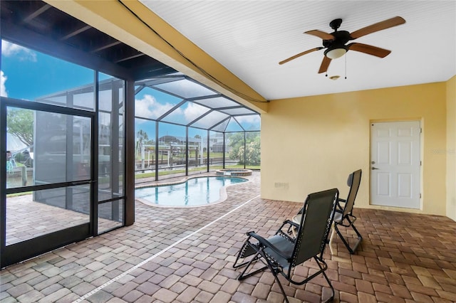 9150 Pine Cove Dr, Englewood, FL 34224 - view of pool with ceiling fan, a pool with connected hot tub, a patio area, and glass enclosure