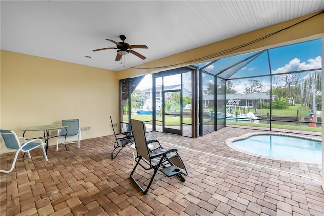 9150 Pine Cove Dr, Englewood, FL 34224 - sunroom featuring a pool and ceiling fan