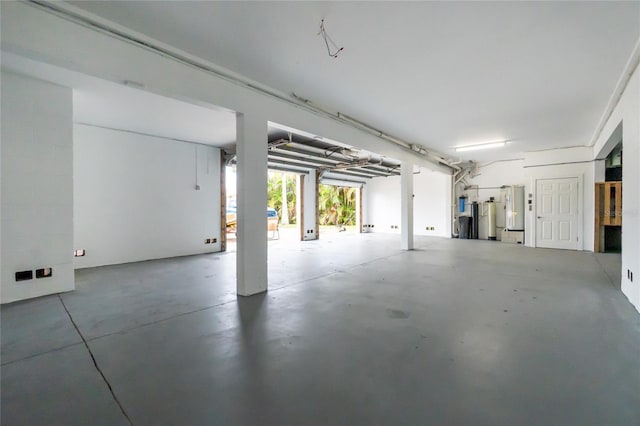 9150 Pine Cove Dr, Englewood, FL 34224 - garage featuring water heater