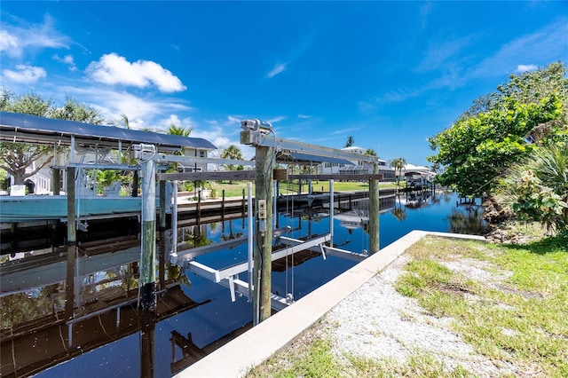 9150 Pine Cove Dr, Englewood, FL 34224 - dock featuring boat lift and a water view