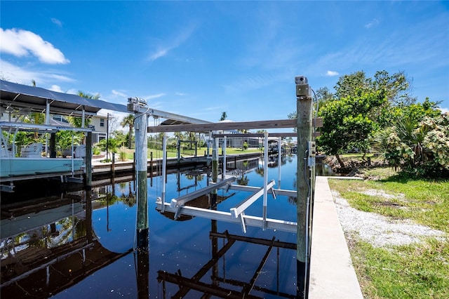 9150 Pine Cove Dr, Englewood, FL 34224 - dock area with boat lift and a water view
