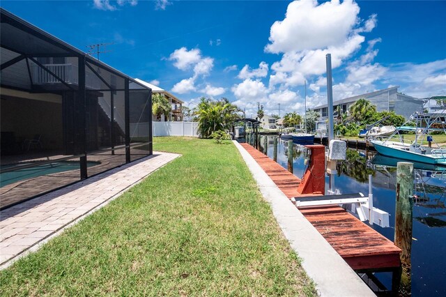 9150 Pine Cove Dr, Englewood, FL 34224 - view of yard with a boat dock, a water view, boat lift, and a lanai