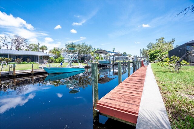 9150 Pine Cove Dr, Englewood, FL 34224 - dock featuring a water view