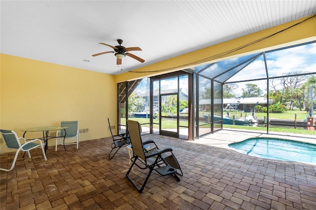 9150 Pine Cove Dr, Englewood, FL 34224 - outdoor pool featuring a patio, ceiling fan, and a lanai