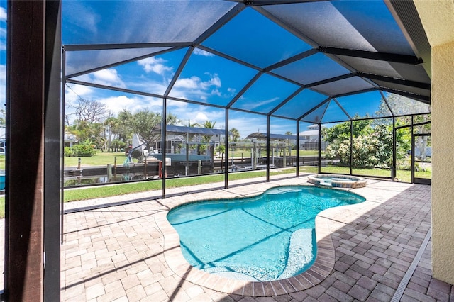 9150 Pine Cove Dr, Englewood, FL 34224 - view of pool with a patio area, a pool with connected hot tub, and glass enclosure