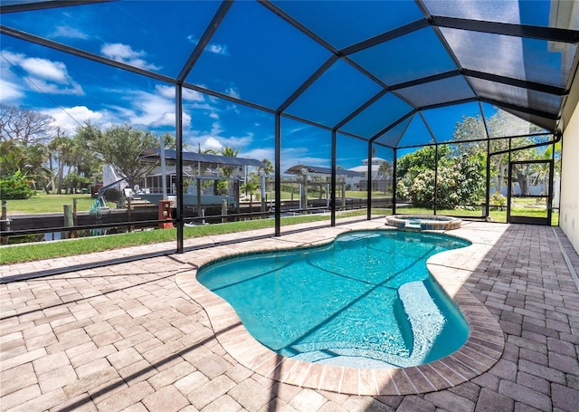 9150 Pine Cove Dr, Englewood, FL 34224 - view of swimming pool with a patio, a pool with connected hot tub, and a lanai