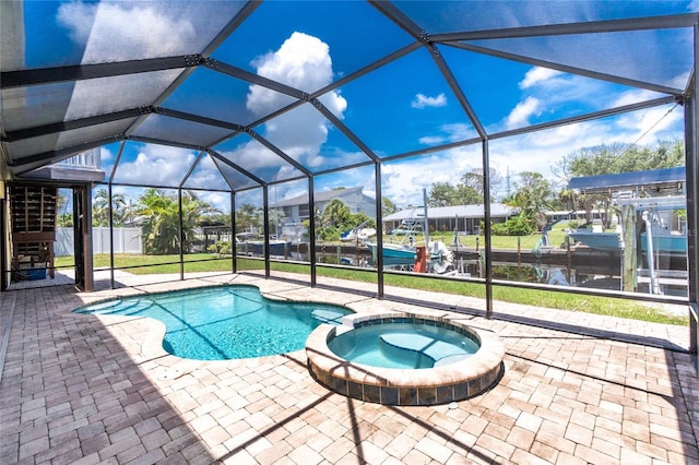9150 Pine Cove Dr, Englewood, FL 34224 - view of pool with a patio, a lanai, and a pool with connected hot tub