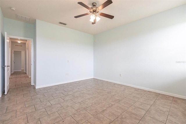 7318 61st St E, Palmetto, FL 34221 - spare room with ceiling fan, a smoke detector, and light tile patterned floors