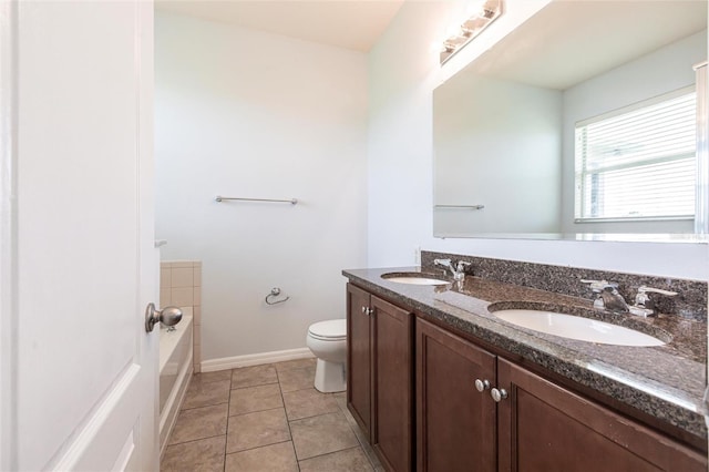 7318 61st St E, Palmetto, FL 34221 - full bathroom with double vanity, a tub, and tile patterned flooring