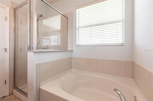 7318 61st St E, Palmetto, FL 34221 - bathroom with a garden tub and a stall shower