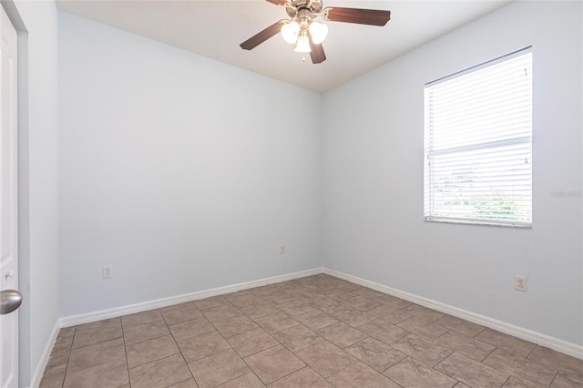 7318 61st St E, Palmetto, FL 34221 - spare room with a ceiling fan and baseboards