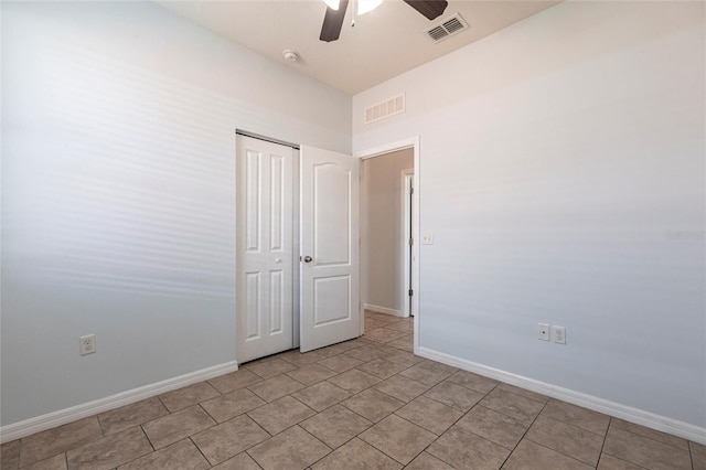 7318 61st St E, Palmetto, FL 34221 - empty room with a ceiling fan, light tile patterned floors, and a smoke detector