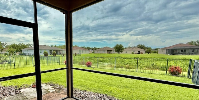 7318 61st St E, Palmetto, FL 34221 - unfurnished sunroom with a residential view